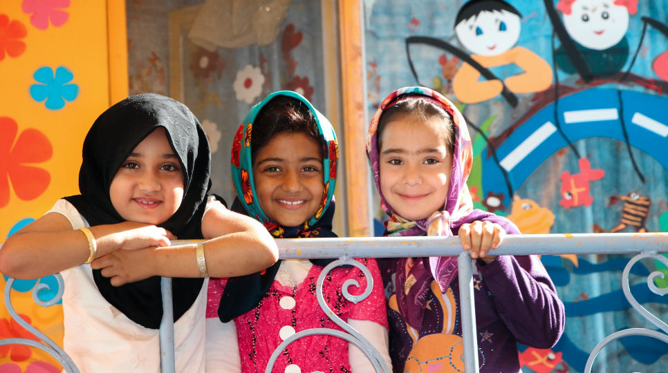 group of children smiling at the camera
