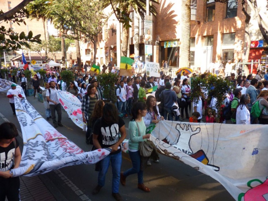 Large crowd of protesters marching.