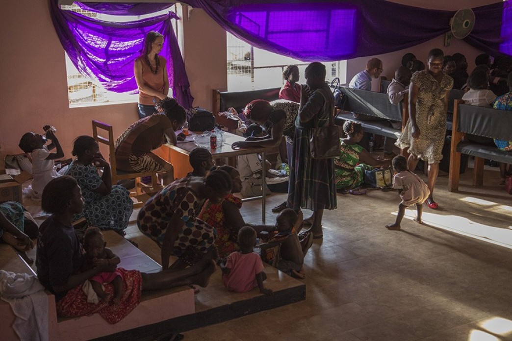 Mothers and children in a large, spacious room.