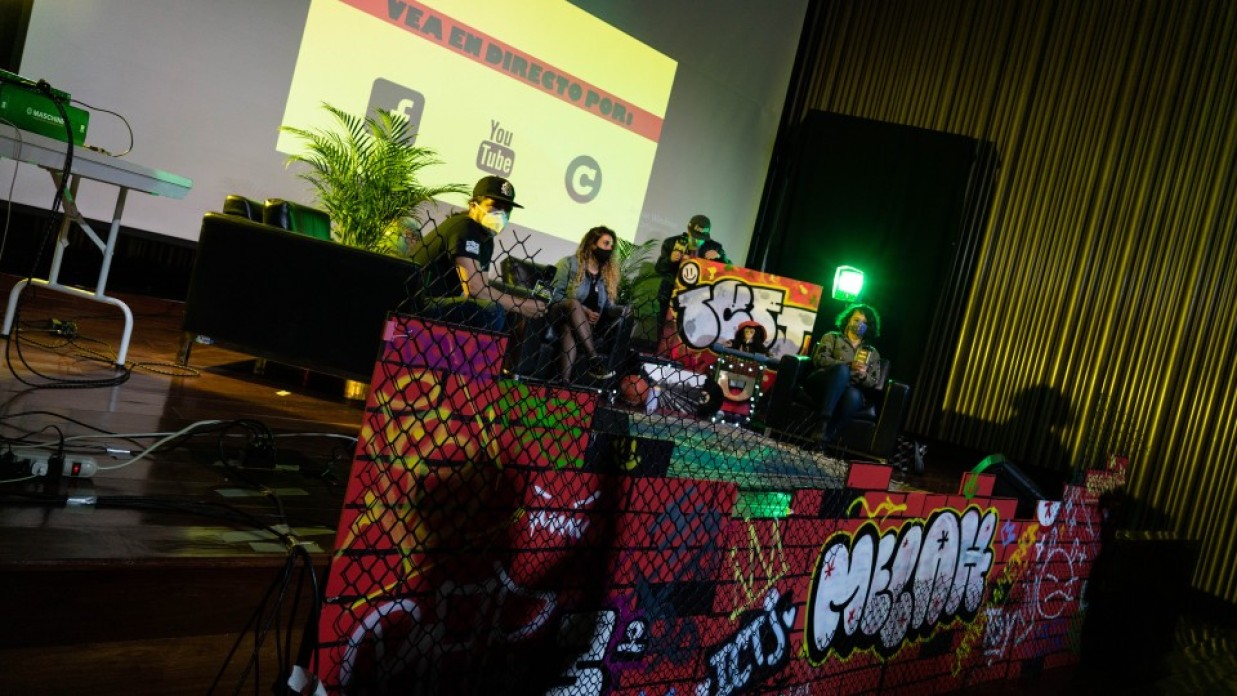 A group of people sitting on a stage.