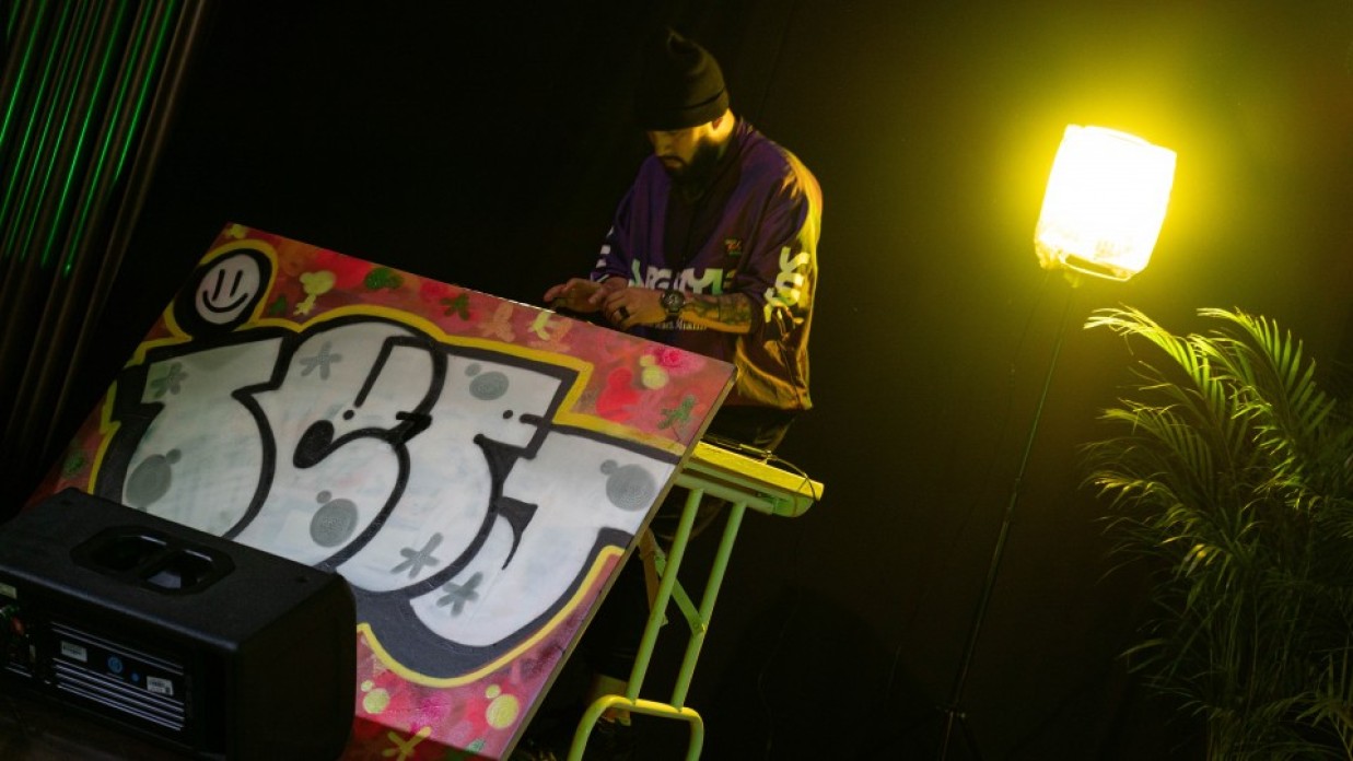 A musician behind a booth.