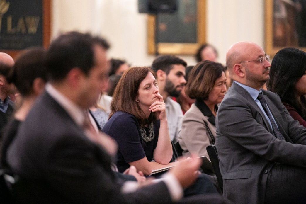 A woman watching a presentation.